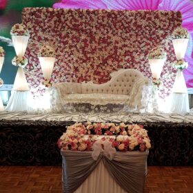 stage decoration with custom made lamps, white and red followers backdrop.